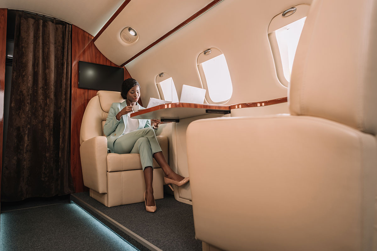 woman working on private jet